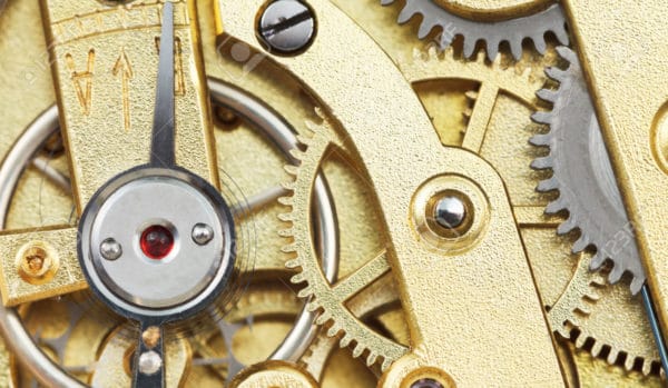 brass mechanical movement of vintage clock close up